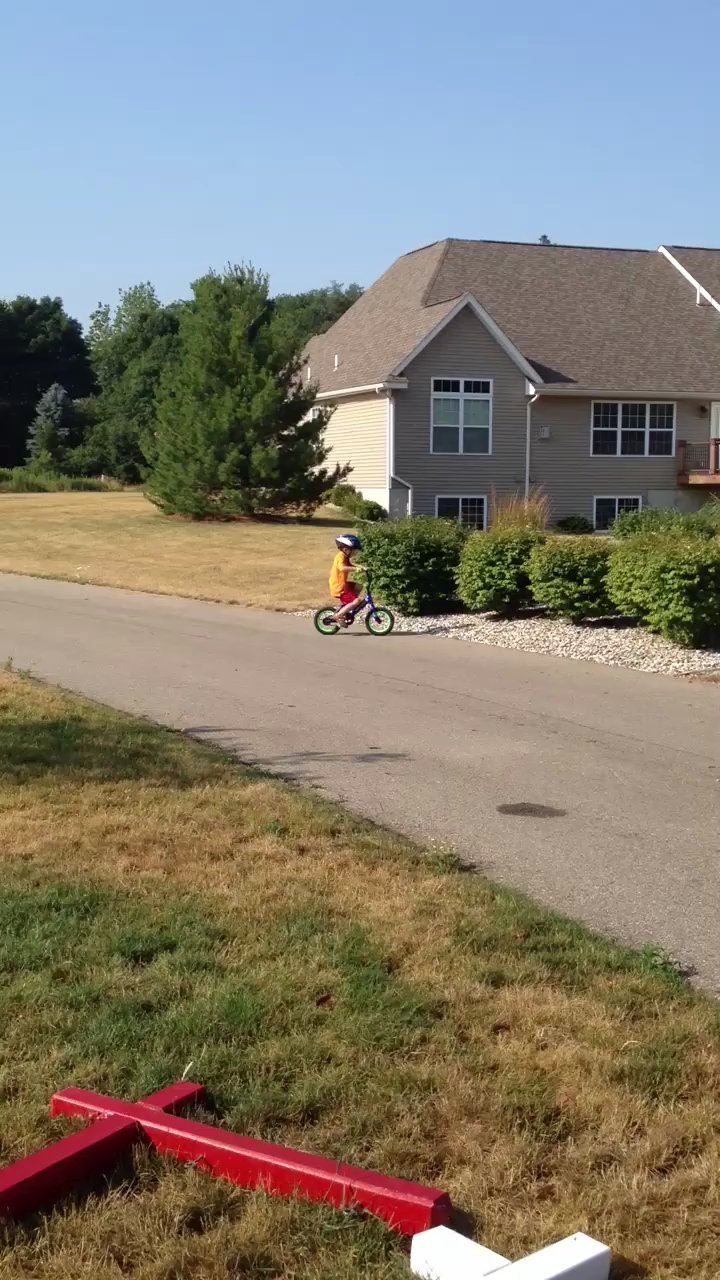 Teaching one kid to ride the bike and the other to go potty. T…